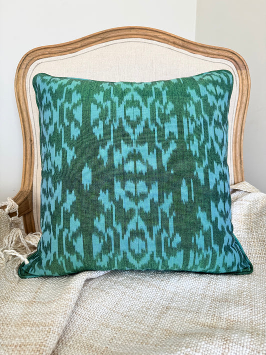 Emerald Weave handwoven Ikat cushion cover crafted from artisan textiles. A timeless decorative cushion designed to add colour and texture to modern interiors.
